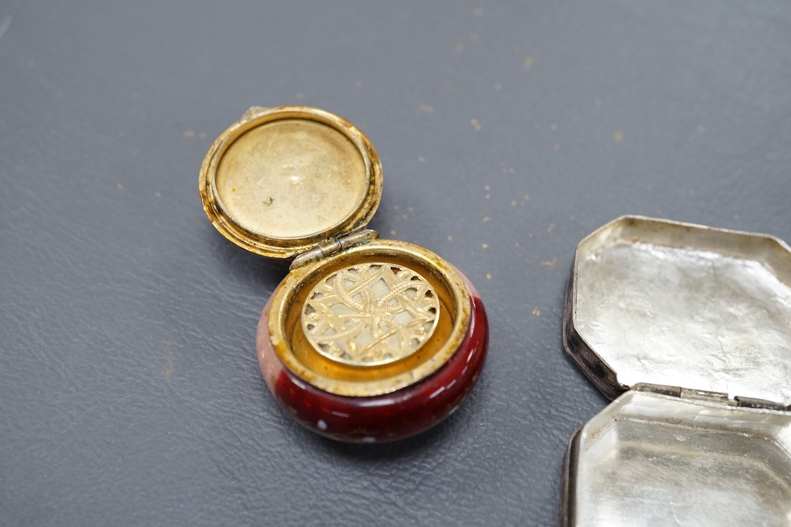 A 19th century Viennese gilt white metal and enamel circular vinaigrette, makers mark J.i.G, diameter 29mm, together with two late 19th century silver mounted senet bottles, a white metal and enamel pill box, a propellin